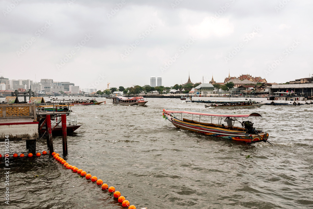 Water taxi and public boats on the river in Bangkok, Thailand