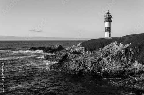 Ribadeo, Spain. The lighthouse at Illa Pancha, an island in the coast of Galicia photo