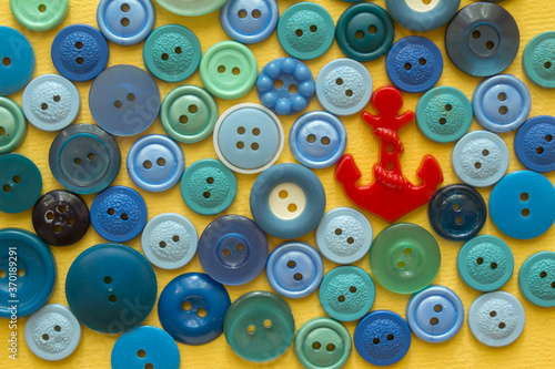 sea of sewing buttons with red anchor-button 