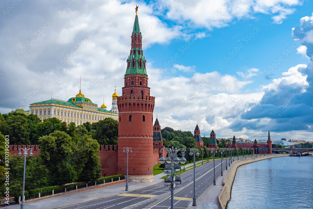 Moscow. Russia. The Kremlin wall is made of red brick. Kremlin tower. Kremlin embankment. Panorama of Moscow on a cloudy day. Moscow in the summer. Architecture Of Russia.