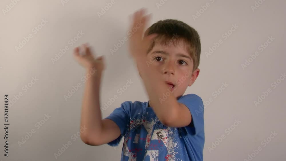4k 50fps Child poses serious and then claps 4k 50fps Child poses serious and then claps