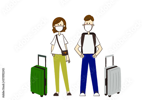 マスクをつけて旅行に行く男性と女性