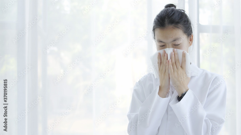 Girl covering her nose with her hand