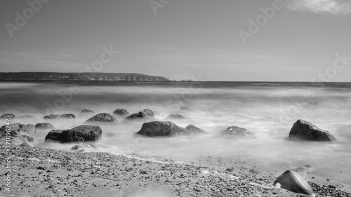 Waves caring the sand. Long Exposure Black and White