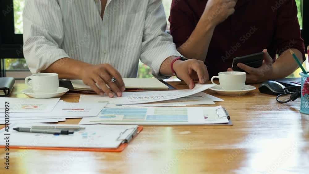 Businessmen financial inspector and secretary calculating balance. Internal Revenue Service inspector checking financial document. Planning budget, audit concept. Businessmen financial inspector and secretary calculating balance. Internal Revenue Service inspector checking financial document. Planning budget, audit concept.