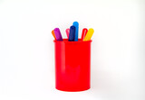 Colored pencils in a glass isolated on a white background