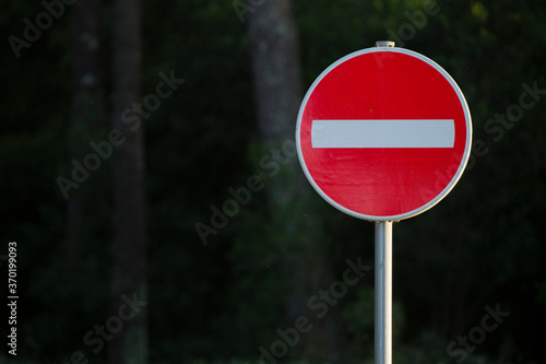 Traffic signal in a public garden. Prohibited sign. photo