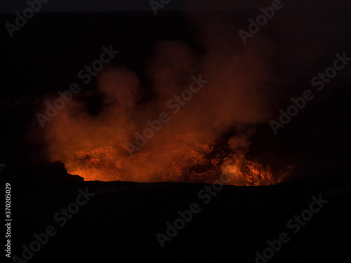 Lava in a volcanic crater glowing at night