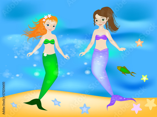 Two young beautiful mermaids swim in the sea.