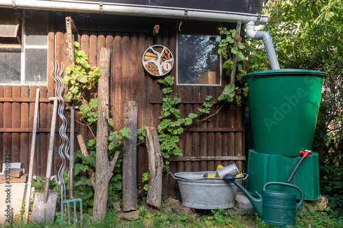 Canvas-taulu back garden with vintage shed and rain water collection and harvesting system