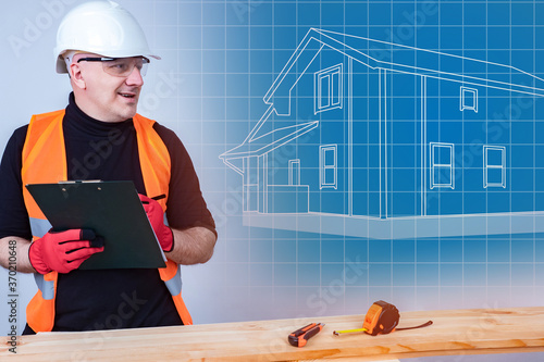 Smiling Builder next to the...