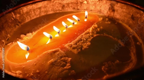 Candles burning in a Tibetan Monastery, China photo