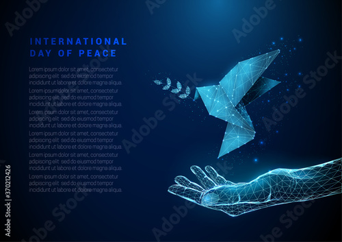 Abstract open hand with flying paper bird with olive branch