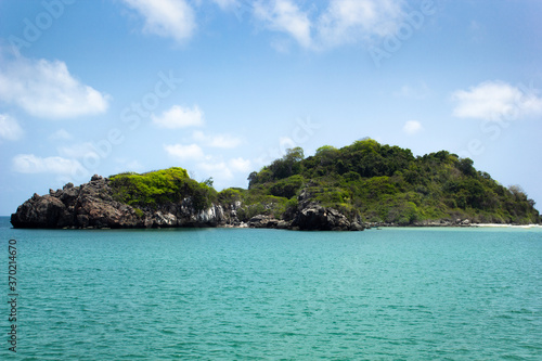 An island in the beautiful tropical sea, blue sky and green sea