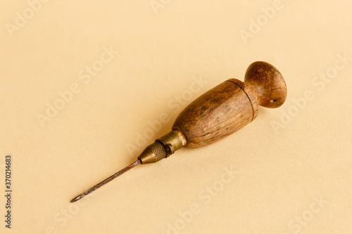 old tool for working wool /old wooden and metal tool for working wool