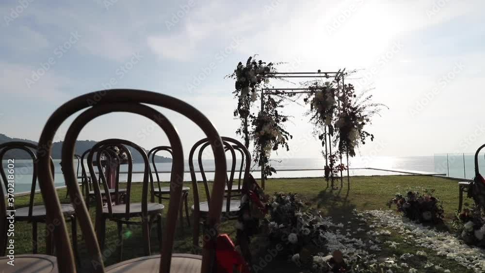 Wedding arch, chairs for guests, wedding accessories and decorations. Wedding ceremony. Beautiful wedding setup. Wedding arch, chairs for guests, wedding accessories and decorations. Wedding ceremony. Beautiful wedding setup.
