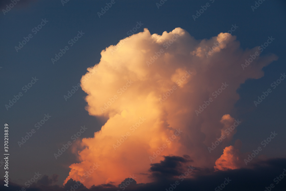 Fototapeta premium Clouds on the background of pure nea at sunset