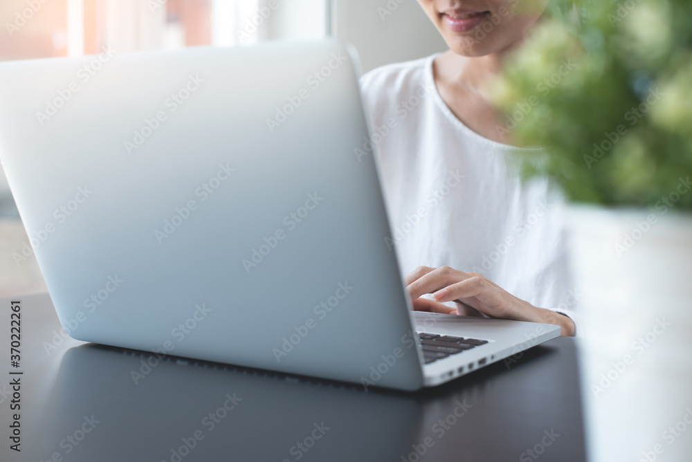 Business woman working on laptop from home office Business woman working on laptop from home office