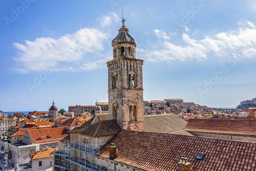 Church tower of Dominican Monastery (Dubrovnik Dominikanski Samostan, 1225) and the orange-tiled roofs of old town. Dubrovnik, Mediterranean, Croatia. photo