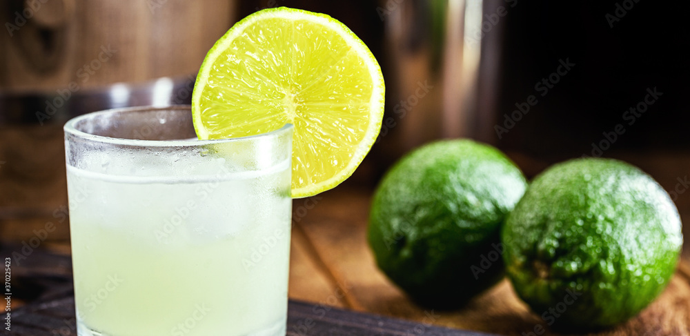 Brazilian Caipirinha, typical Brazilian cocktail made with lemon, cachaça and sugar. Traditional drink from Brazil Brazilian Caipirinha, typical Brazilian cocktail made with lemon, cachaça and sugar. Traditional drink from Brazil