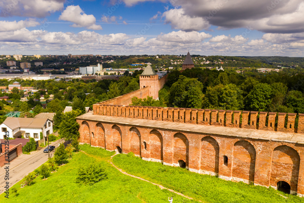 vintage brick fortress wall on green background filmed from drone