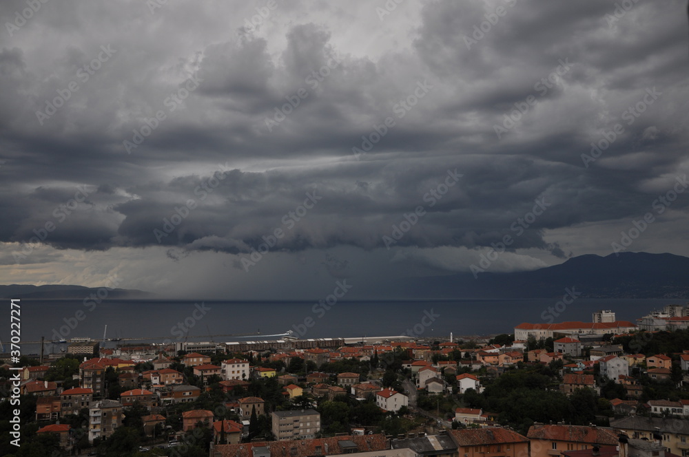 Shelf cloud over Rijeka bay. storm clouds over the city.