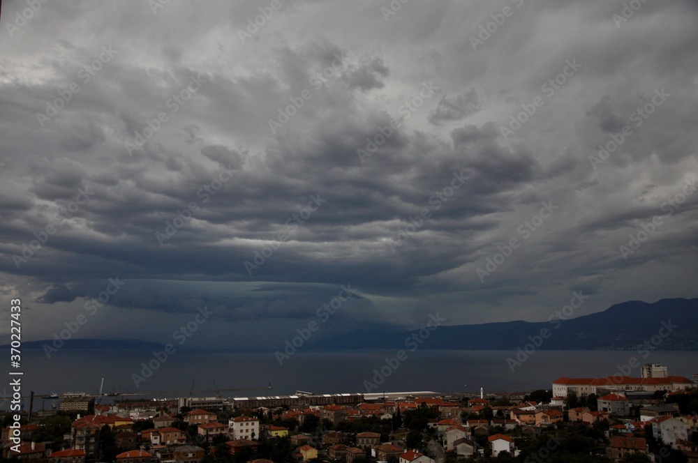 Shelf cloud over Rijeka bay. storm clouds over the city.