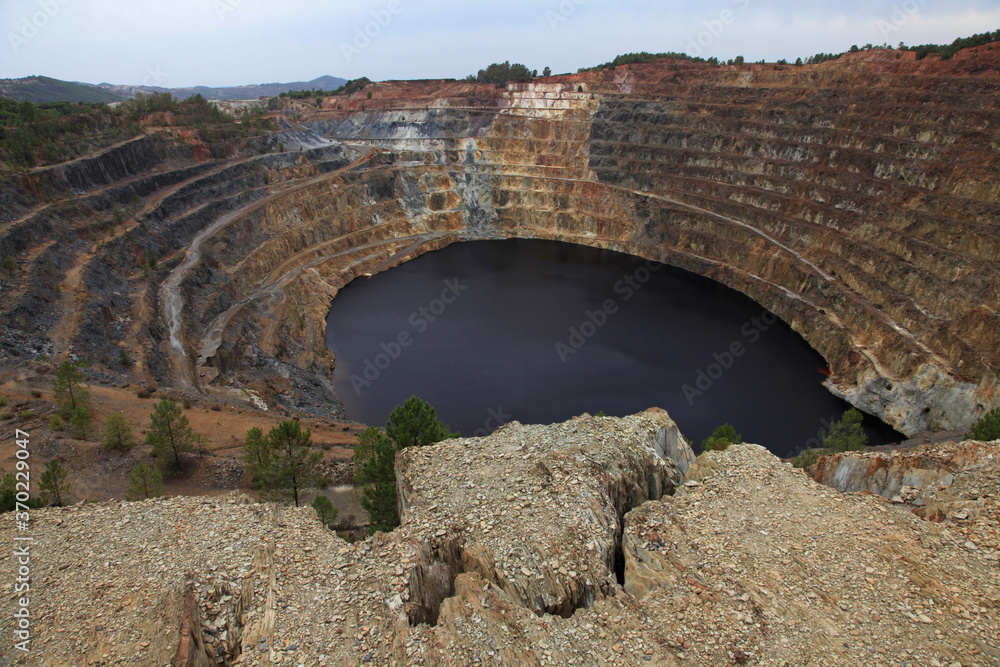 Inactive quarry Corta Atalaya with a red lake at the bottom. Riotinto. Spain.