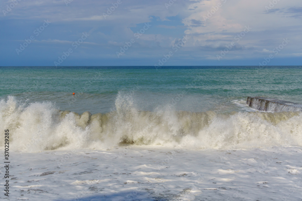 Sea wave in a storm close-up. Lots of splashes.