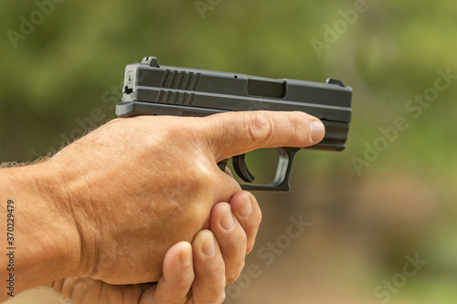 hand holding gun