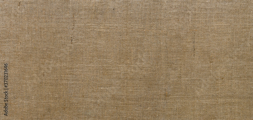 Burlap texture. Sackcloth rustic canvas background. Large piece of rough fabric woven of flax, jute or hemp. Design element.