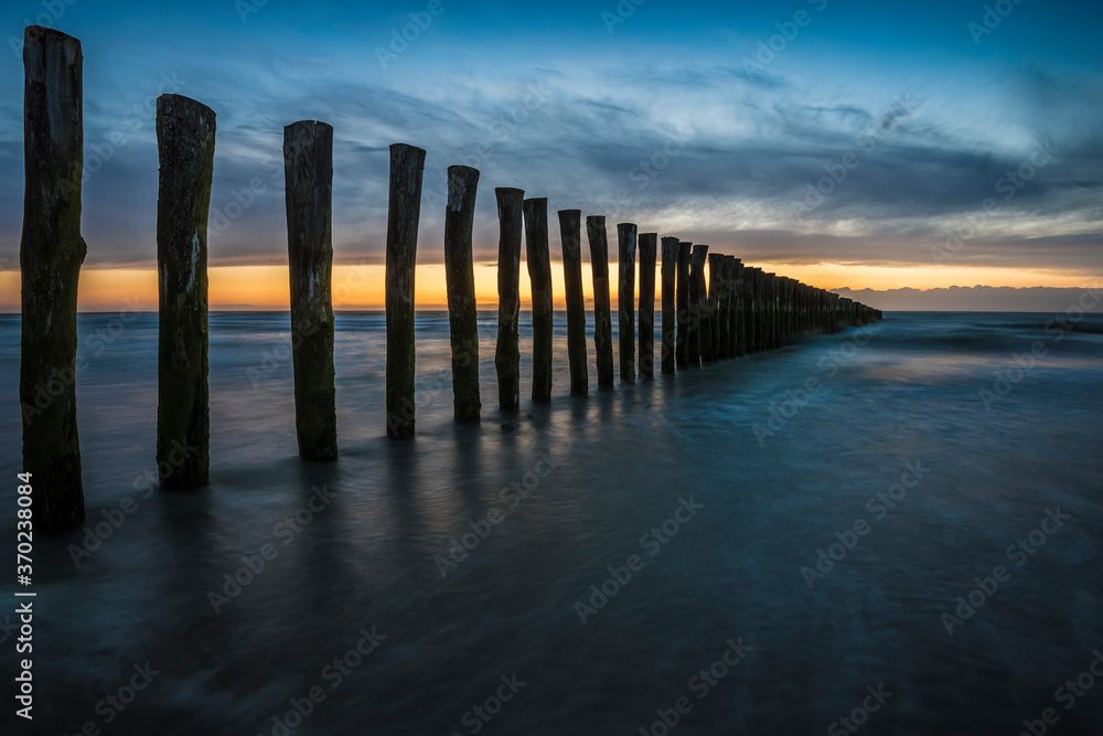 Sunset with a row of poles near Calais. Sunset with a row of poles near Calais.