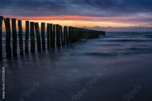Sunset with a row of poles near Calais. © roostler
