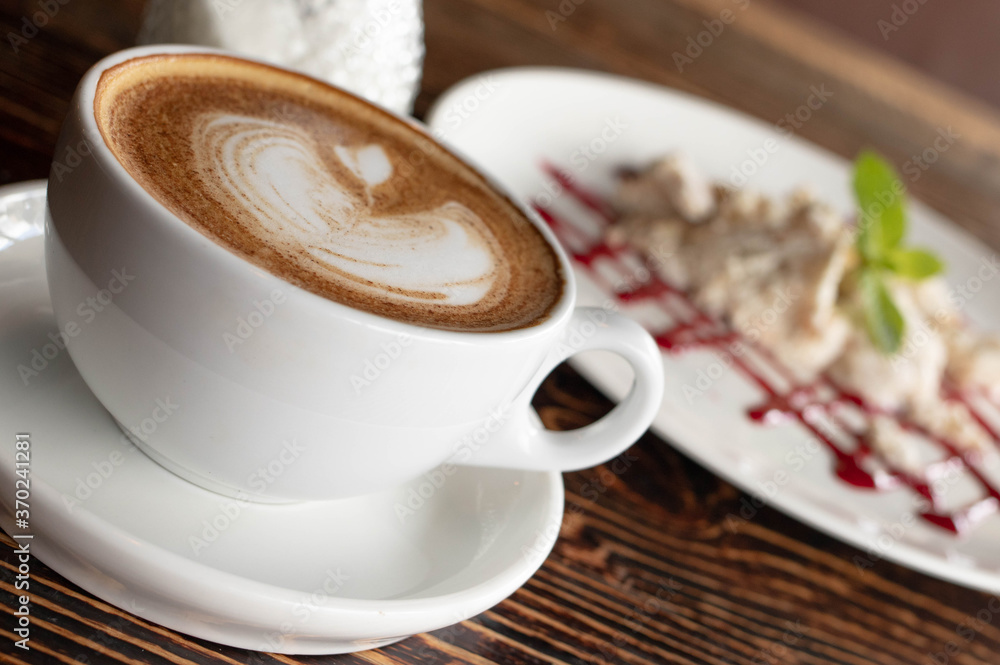 a white ceramic cup of cappucino as a coffee break concept a white ceramic cup of cappucino as a coffee break concept