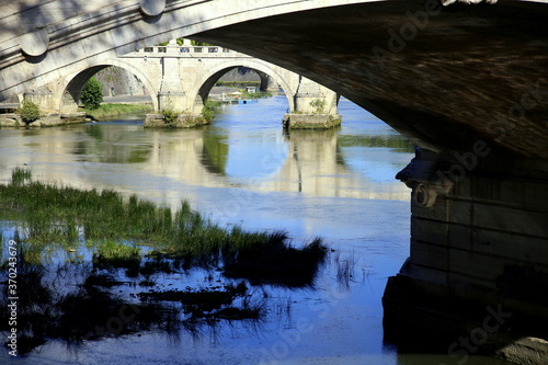 Bridges, arches and reflection on the river, Rome, Italy © l