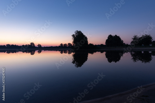 sunrise over the lake with calm water