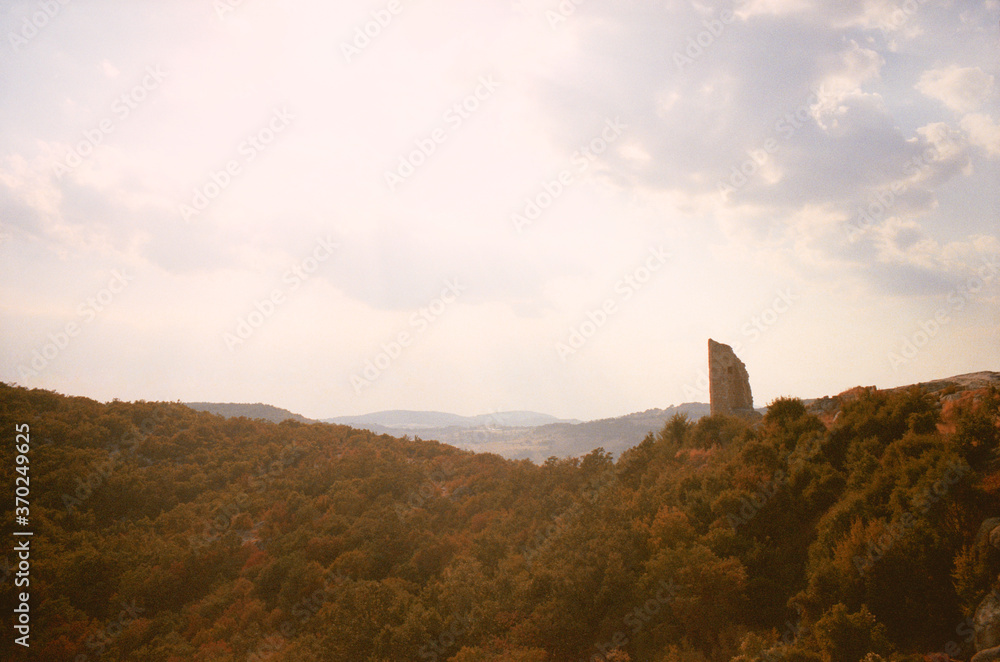 View of the ancient ruins of Perperikon in Bulgaria on a summer day at sunset. The real grain of the scanned film.