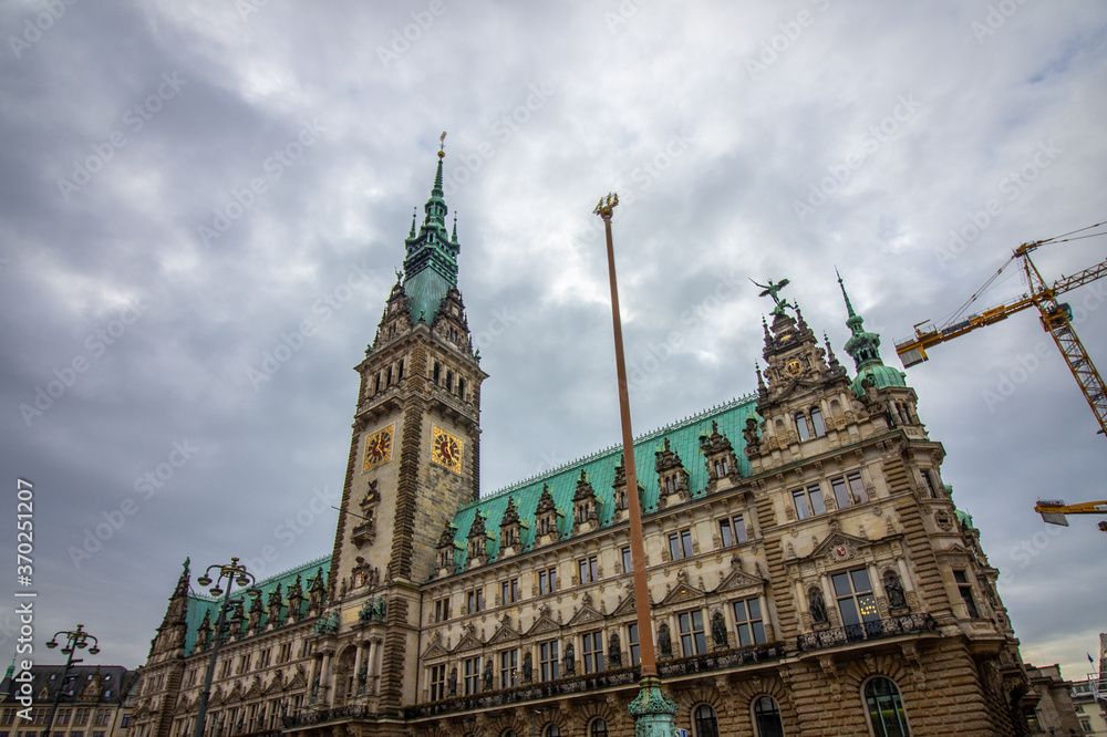 The famous Hamburg town hall with dramatic clouds at market square Hamburg, Germany.