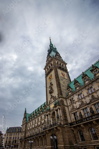 The famous Hamburg town hall with dramatic clouds at market square Hamburg, Germany.