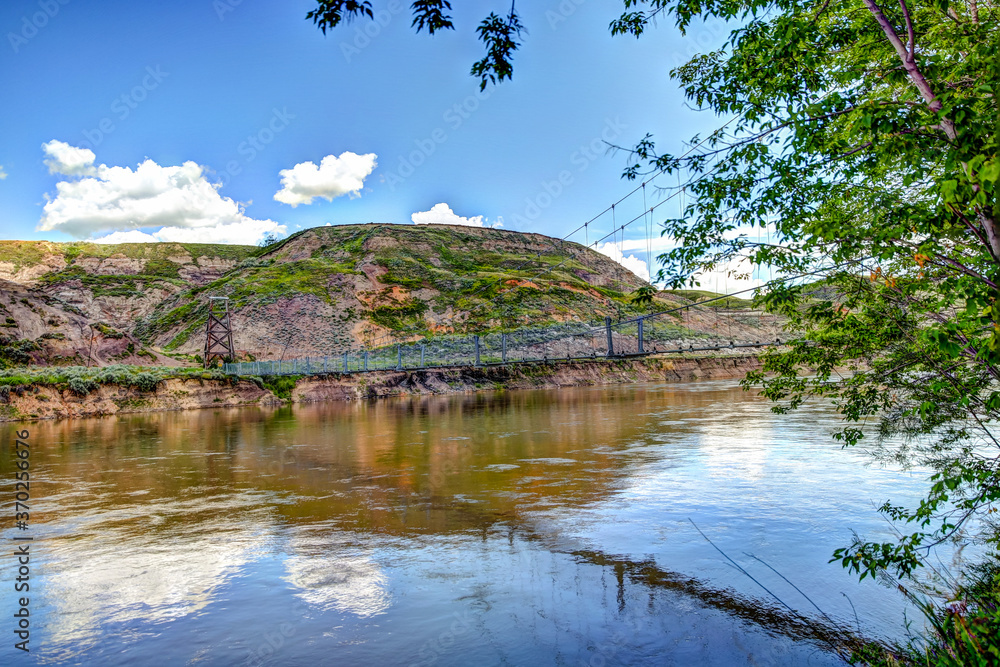 Fototapeta premium Suspension bridge to a coal mine over the Red Deer River in Alberta's Badlands