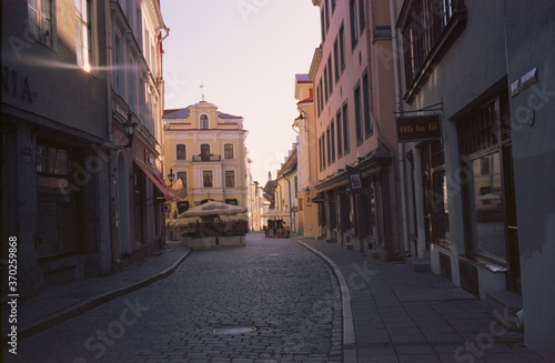 Fototapeta Naklejka Na Ścianę i Meble -  Panoramic view of the central streets of Tallinn on a summer morning in Estonia. Real grain scanned film.