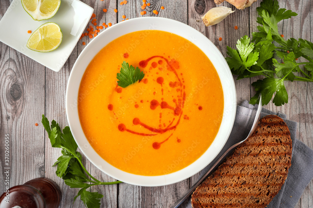 Close up of creamy winter lentil soup on gray rustic background Close up of creamy winter lentil soup on gray rustic background