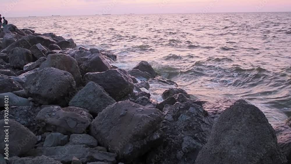 waves crash on an old ruined pier near the sea. Sunrise Sunset. nobody. Overall plan. waves crash on an old ruined pier near the sea. Sunrise Sunset. nobody. Overall plan.