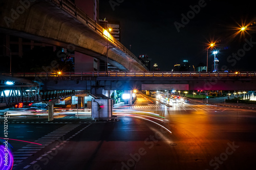 Light trails on the street at sathorn square bangkok thailand.