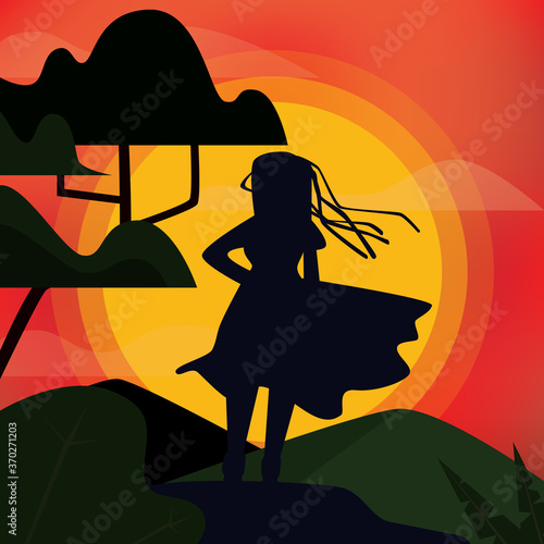 Vector illustration of silhouette of woman standing on a hill with locks or hair and dress blowing in the wind looking at the orange sky and big sun. Girl is outdoors with mountains, trees and plants 