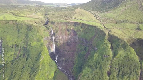 Aerial of Ribeira Grande Waterfall with Rainbow near Faj��zinha, Flores Island photo