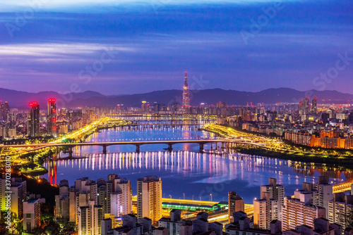 Twilight and cityscape of Seoul,Han river and Lotte tower best landmarkseen from maebongsan. mountain at summer in south korea