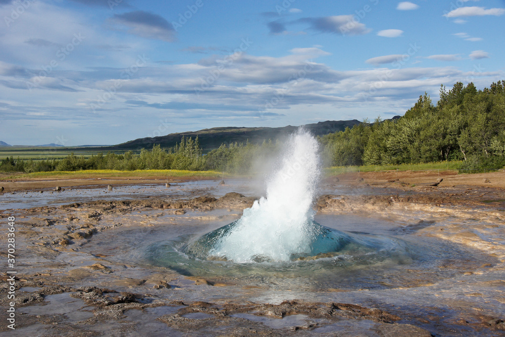 Strokkur Geyser erupting from blue bubble, Geysir, Iceland Strokkur Geyser erupting from blue bubble, Geysir, Iceland