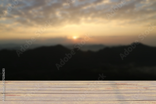 shelf floor with light mist in morning sunrise on the mountain for the background.