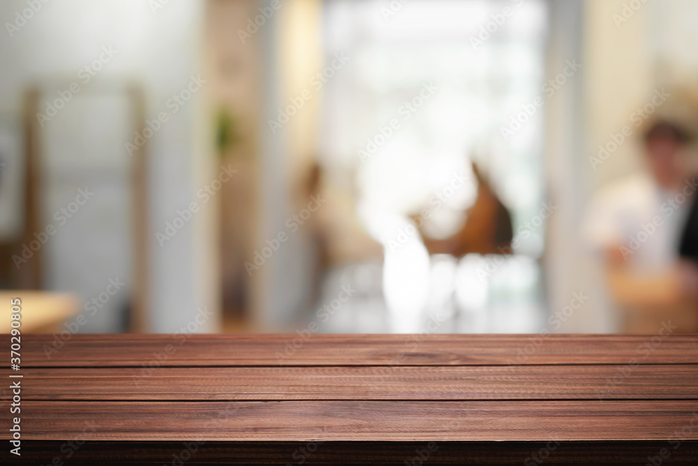 Cafe or Restaurant blurred background with empty wood montage. Cafe or Restaurant blurred background with empty wood montage.